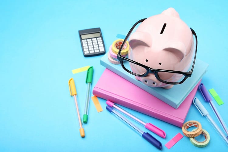 Piggy bank with school supplies