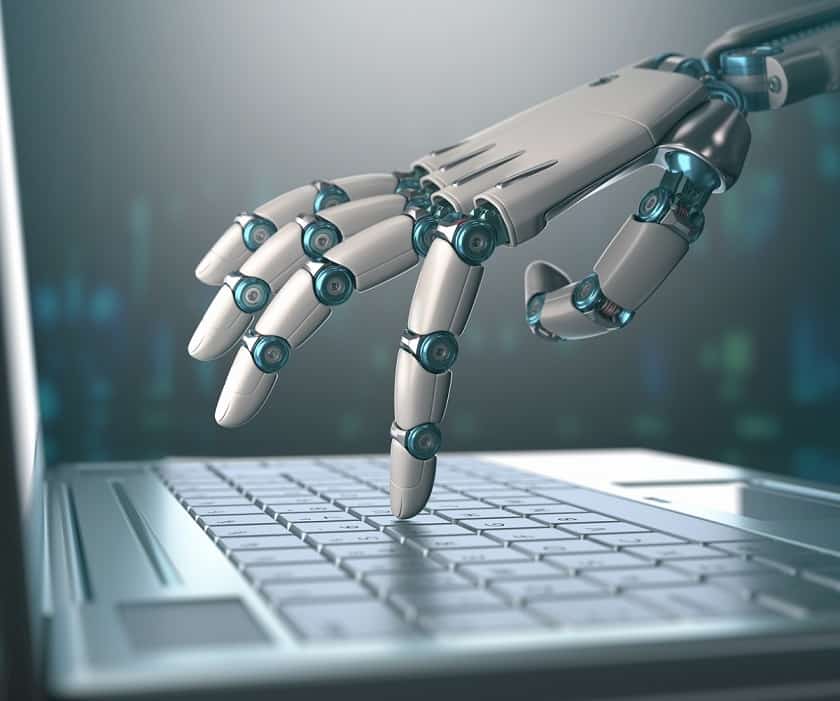 Robot hand on laptop